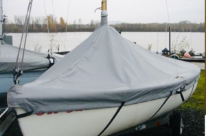 Lido 14 mast up cover. Comes with straps and elastic cord around the bottom to hold it against the hull. Comes in either Sunbrella or Top Gun fabric